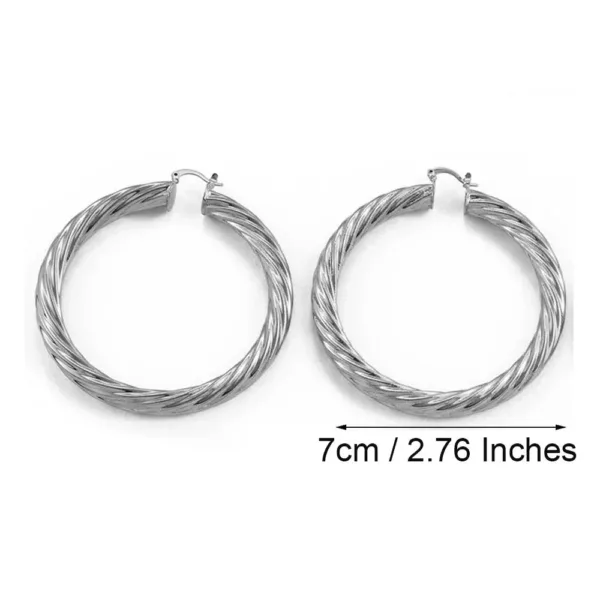 Boucle d'oreille africaine artisanale en spirale