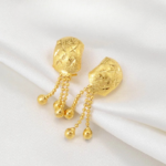 Élégante boucle d’oreille ronde, touche africaine moderne