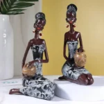 Statue représentant une femme musicienne africaine